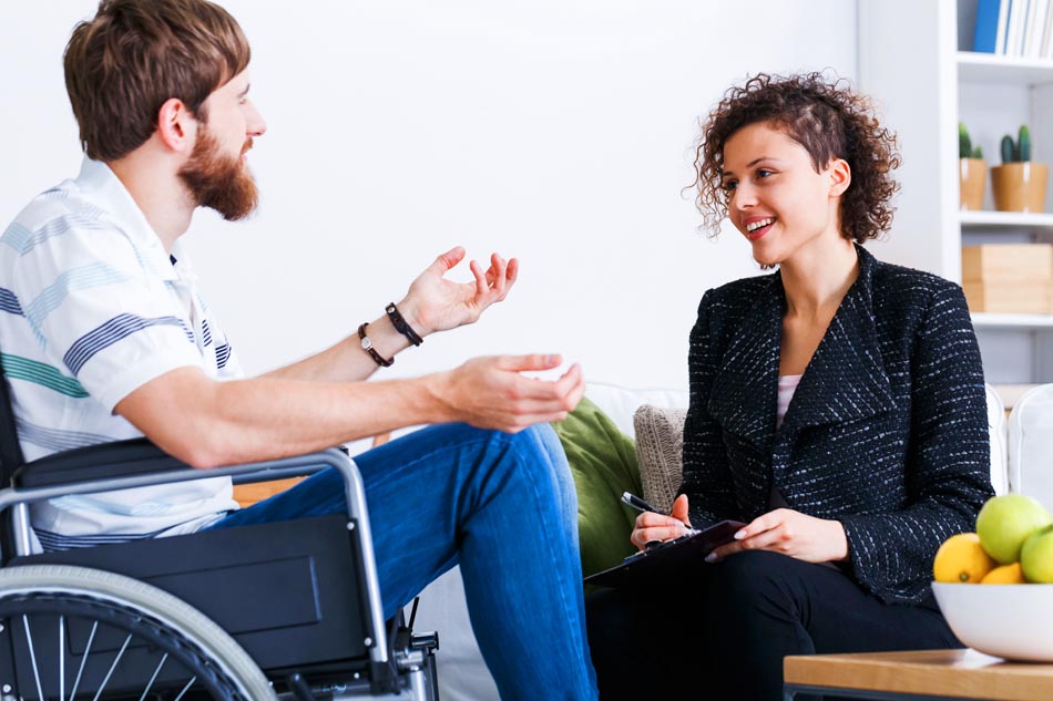 ms patient in wheelchair with caregiver